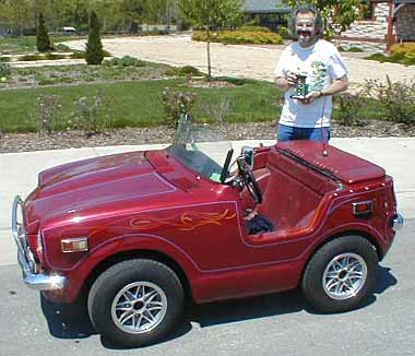 A converted Honda 600 Coupe in an Artcar Parade in Kansas