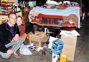 James & Elise in front of a rare Honda S600 